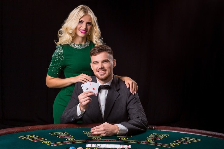 Professional dealer conducting live blackjack game with cards visible on streaming table